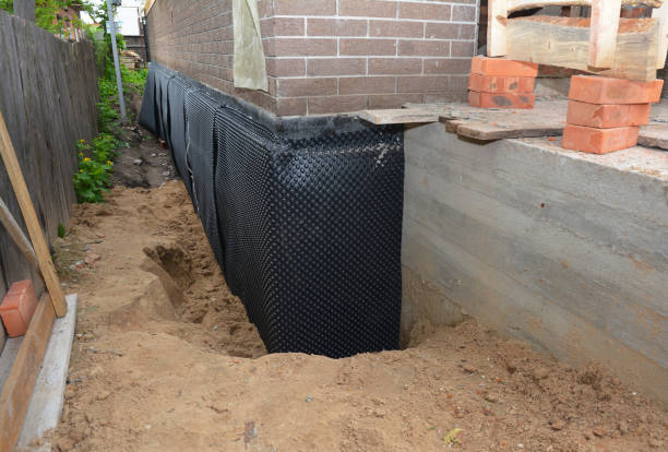 Happy homeowners after waterproofing job in Gaston